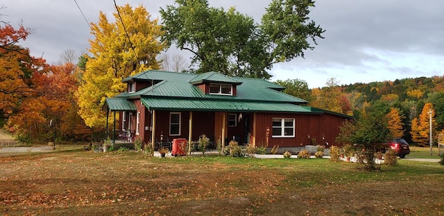1503 Stewart Rd, Addison, NY 14801 - view of front of property featuring covered porch, a front lawn, metal roof, and a wooded view