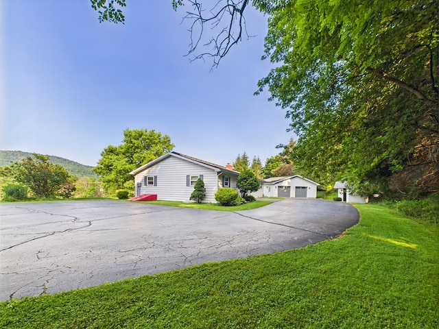 1041 Rte 44, Shinglehouse, PA 16748 - view of front of home featuring a front yard, a garage, and a chimney