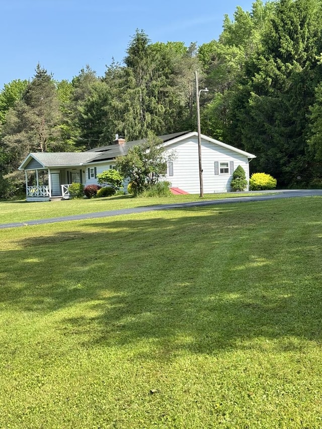 1041 Rte 44, Shinglehouse, PA 16748 - view of front of home featuring a front lawn and covered porch