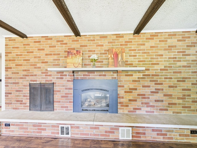 1041 Rte 44, Shinglehouse, PA 16748 - detailed view of beam ceiling, a fireplace, a textured ceiling, and wood finished floors