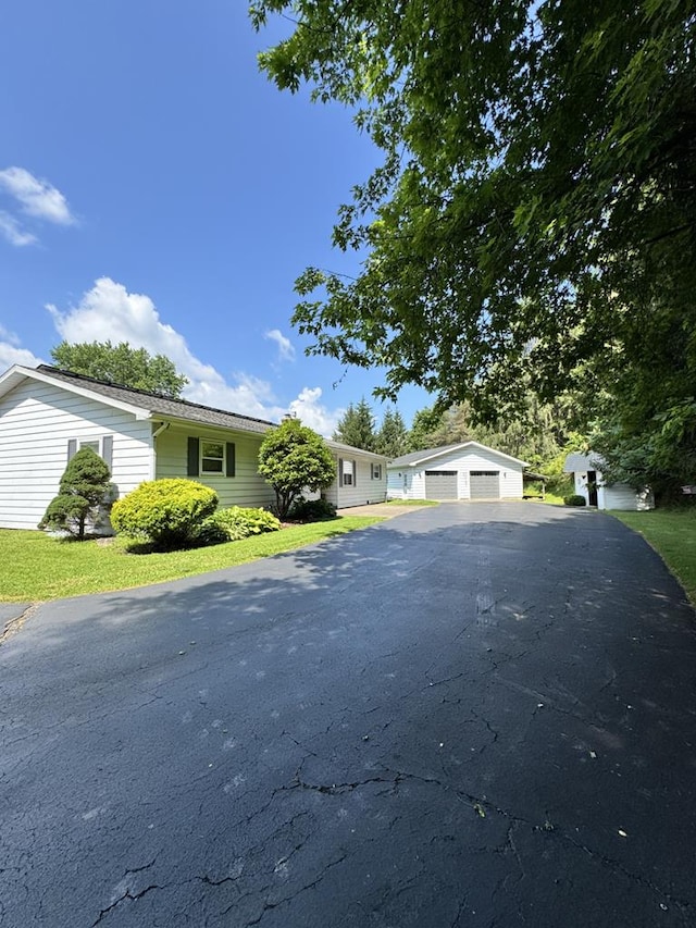 1041 Rte 44, Shinglehouse, PA 16748 - ranch-style house featuring a detached garage and a front lawn
