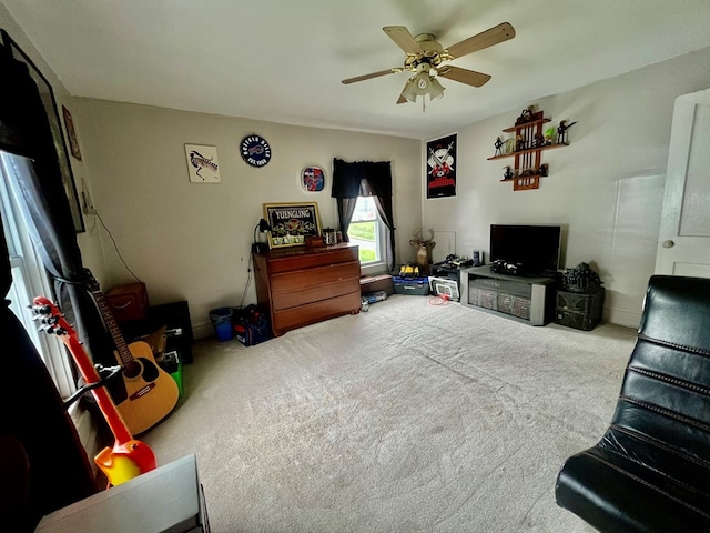 living room featuring light carpet and ceiling fan