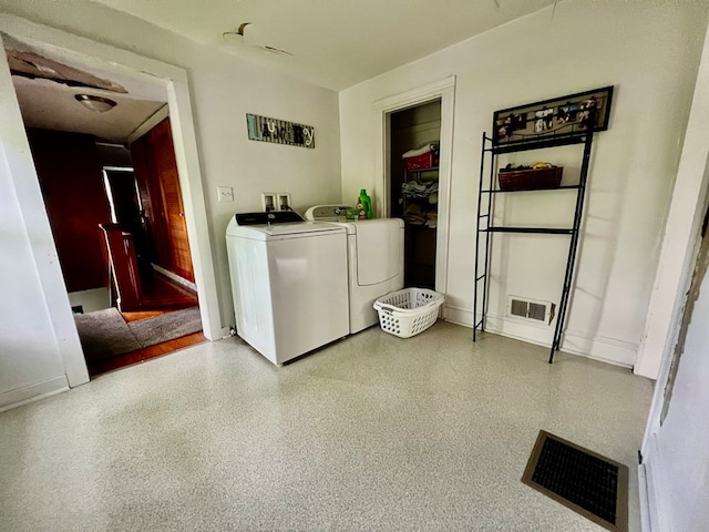 washroom featuring washer and dryer