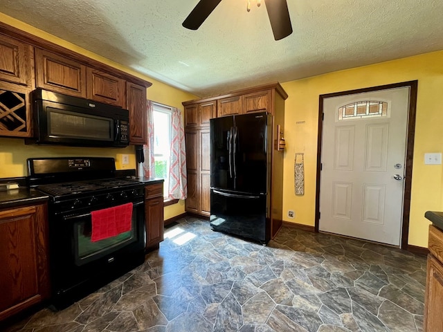 kitchen featuring a textured ceiling, ceiling fan, and black appliances