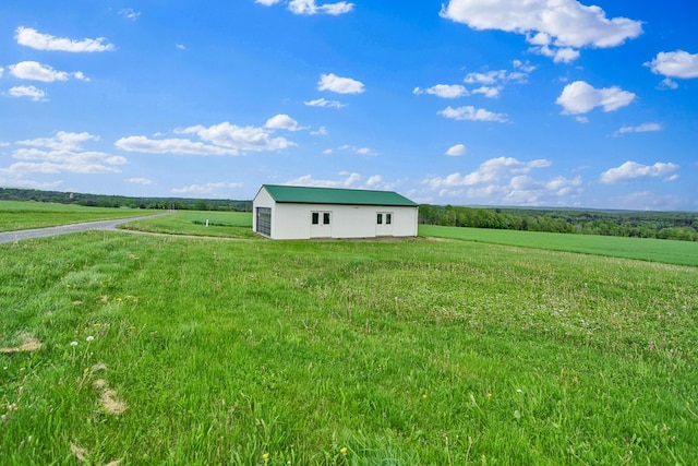 667 Ostrom Hill Rd, Liberty, PA 16930 - view of yard with a rural view, an outdoor structure, and an outbuilding
