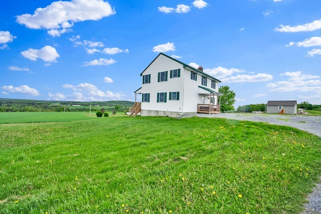 667 Ostrom Hill Rd, Liberty, PA 16930 - view of side of property featuring a chimney, a view of rural / pastoral area, and a yard