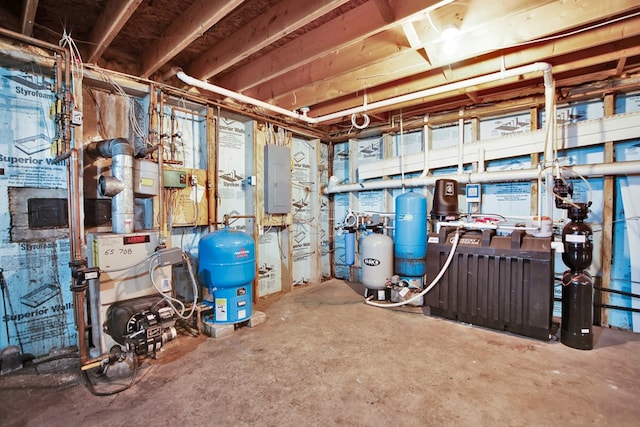 667 Ostrom Hill Rd, Liberty, PA 16930 - unfinished below grade area with electric panel and a water pressure tank