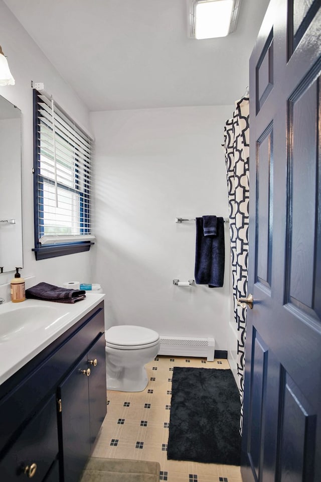 667 Ostrom Hill Rd, Liberty, PA 16930 - bathroom with baseboard heating, vanity, toilet, and curtained shower
