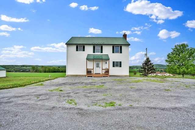 667 Ostrom Hill Rd, Liberty, PA 16930 - view of front facade with a chimney and metal roof