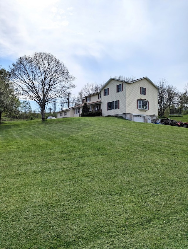 view of yard with a garage