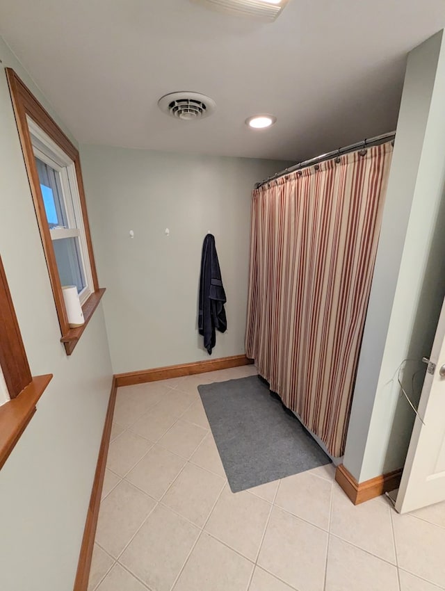 bathroom featuring tile patterned flooring