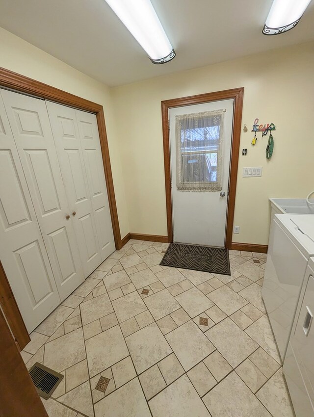 entryway with independent washer and dryer