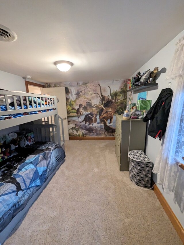 bedroom with light colored carpet