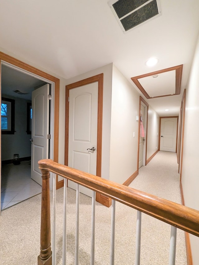 corridor featuring carpet flooring