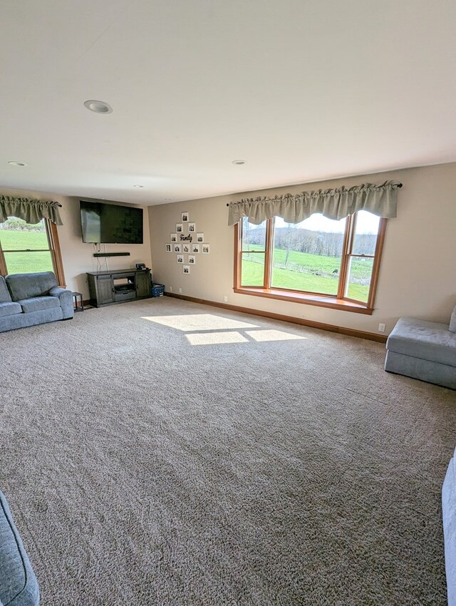 unfurnished living room featuring carpet