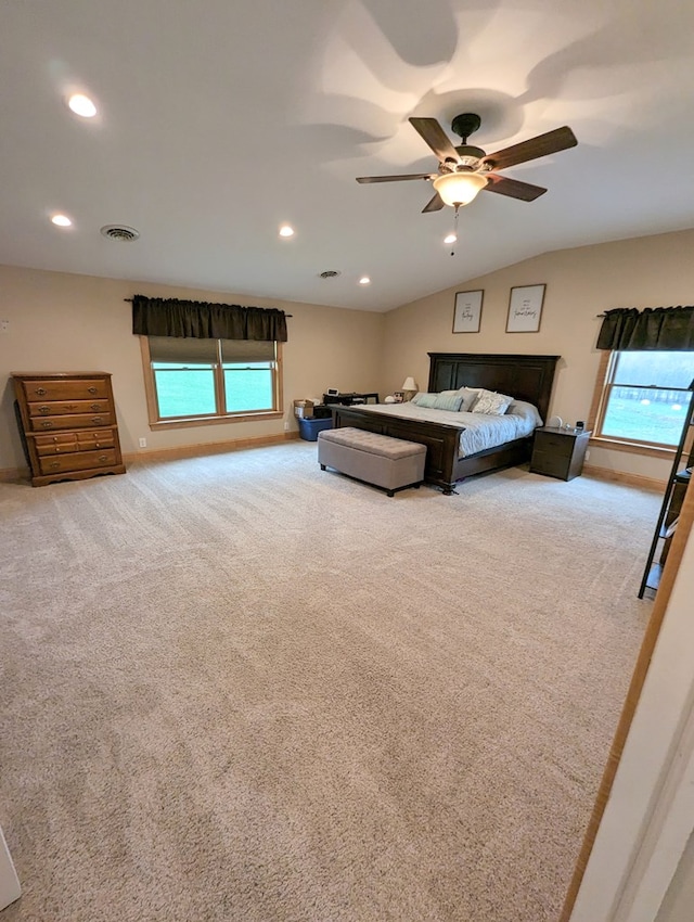 carpeted bedroom featuring ceiling fan and lofted ceiling