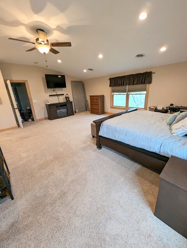 carpeted bedroom featuring ceiling fan and lofted ceiling