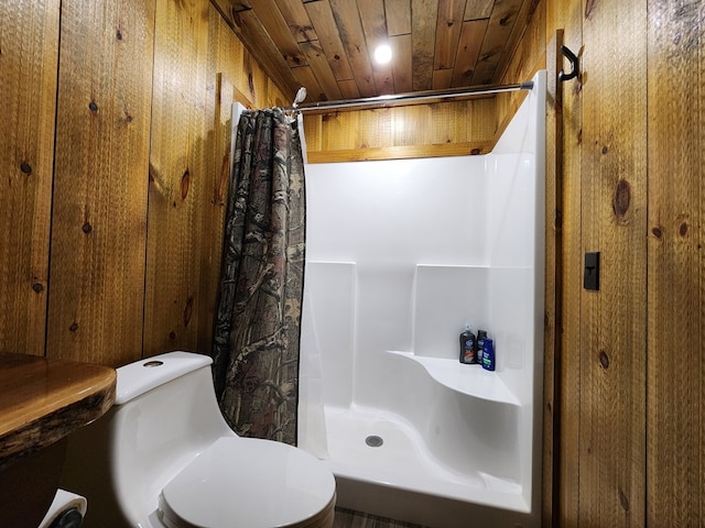 bathroom with a shower with shower curtain, toilet, wood ceiling, and wooden walls