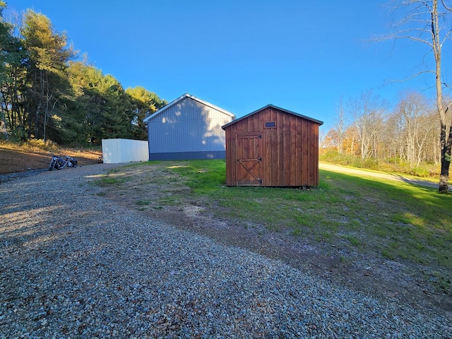 view of outdoor structure featuring a lawn