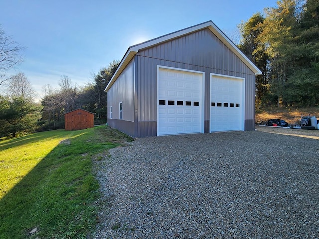 garage featuring a lawn