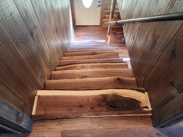 staircase with wooden walls