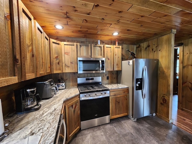 kitchen featuring light stone counters, dark wood-type flooring, wooden ceiling, and appliances with stainless steel finishes