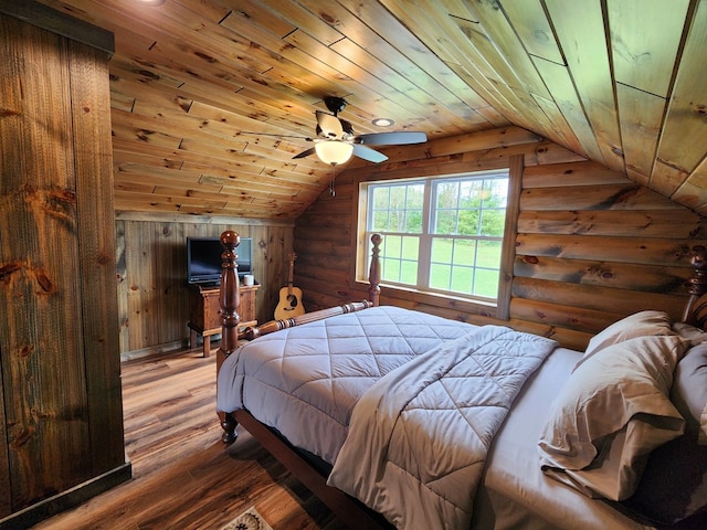 bedroom with rustic walls, ceiling fan, wooden ceiling, wood-type flooring, and vaulted ceiling