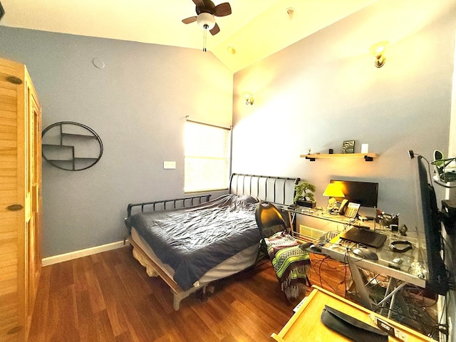 bedroom with lofted ceiling and dark hardwood / wood-style flooring