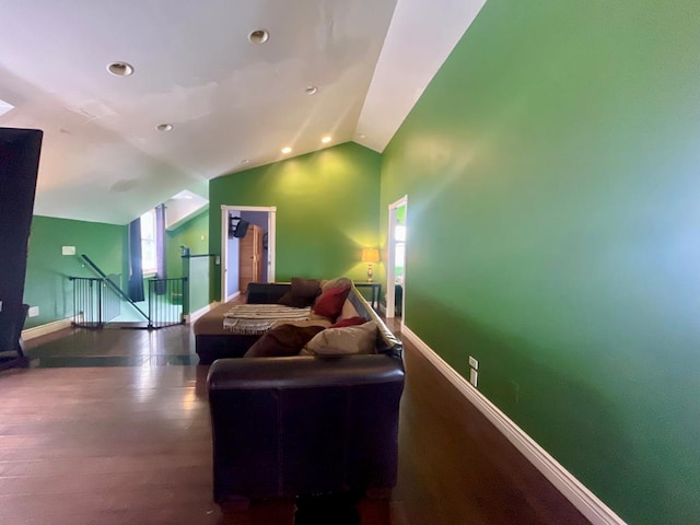 living room with lofted ceiling and hardwood / wood-style flooring