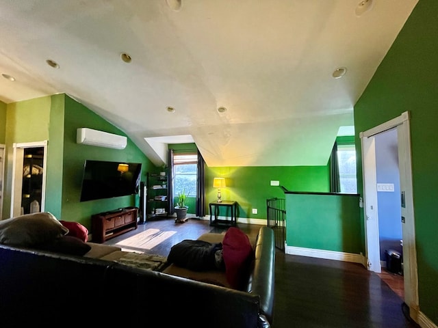 living room featuring vaulted ceiling and a wall mounted AC