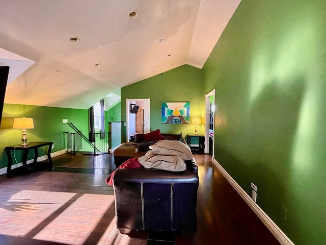 living room with dark hardwood / wood-style flooring and vaulted ceiling