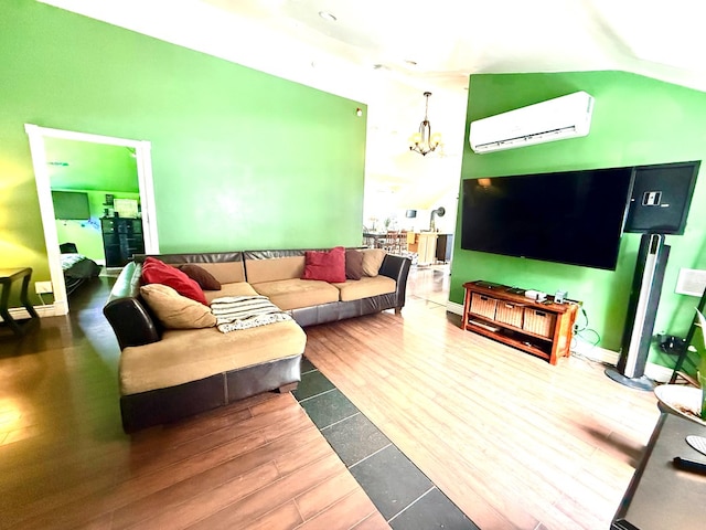 living room with a chandelier, wood-type flooring, a wall mounted AC, and vaulted ceiling