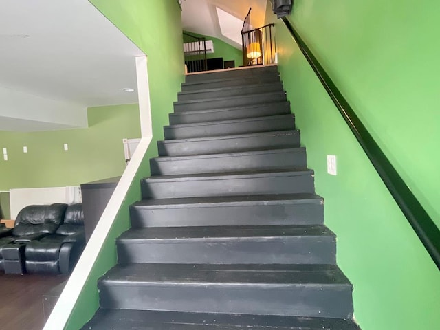 stairs with wood-type flooring