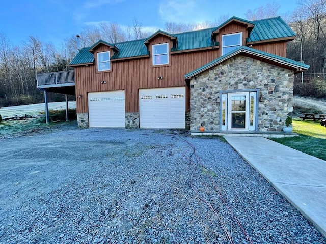 view of front of property featuring a garage and a deck