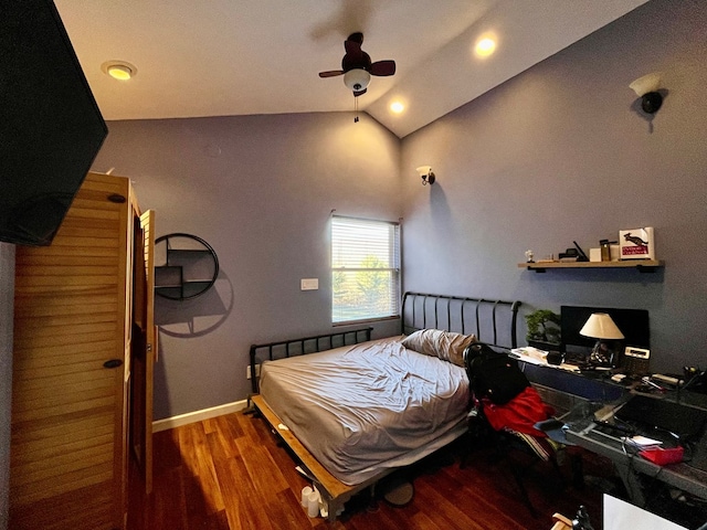 bedroom featuring ceiling fan, vaulted ceiling, and dark wood-type flooring