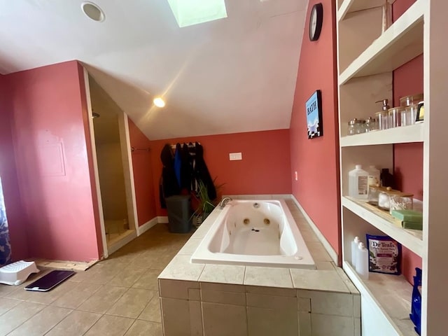 bathroom featuring built in features, tile patterned floors, and a relaxing tiled tub