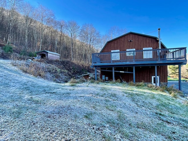 view of home's exterior featuring a wooden deck