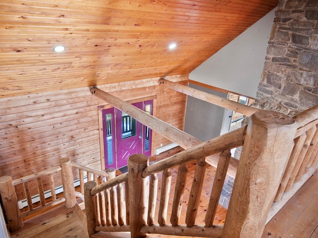 staircase featuring wooden ceiling, high vaulted ceiling, and hardwood / wood-style floors