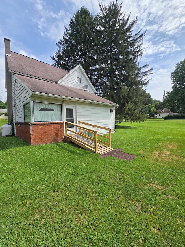 258 Pleasant Stream Rd, Trout Run, PA 17701 - back of house with a lawn and a chimney