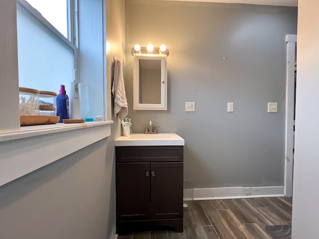 bathroom with vanity and hardwood / wood-style floors