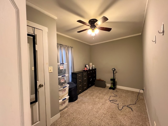 bedroom featuring ornamental molding, light colored carpet, and ceiling fan