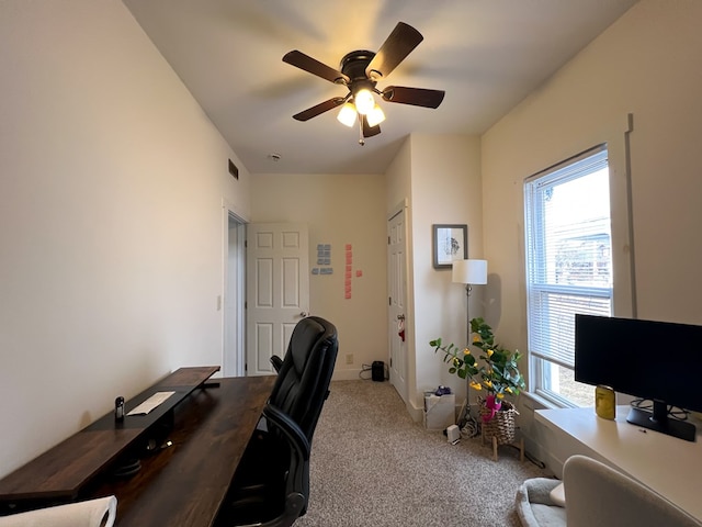 office space with carpet and ceiling fan