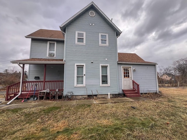 rear view of house with a lawn