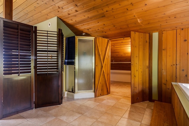 interior space featuring wood walls, wooden ceiling, and vaulted ceiling