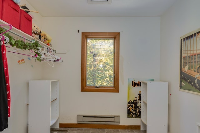 laundry room featuring a baseboard heating unit