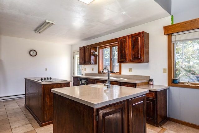 kitchen with a center island, sink, white electric cooktop, a baseboard radiator, and light tile patterned flooring