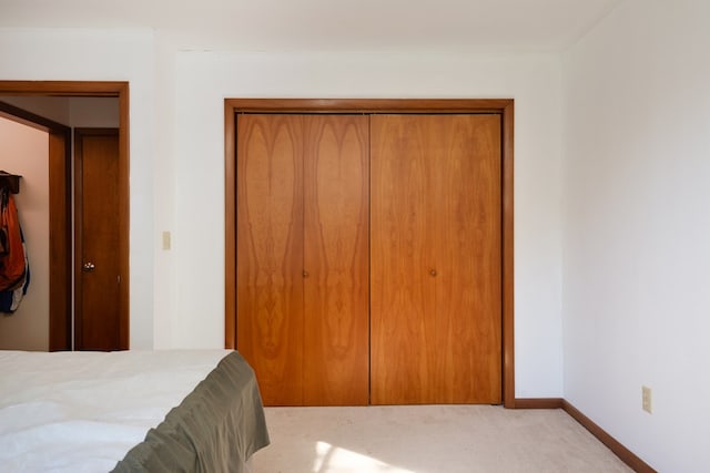 carpeted bedroom with a closet