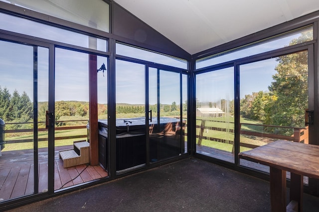 unfurnished sunroom with lofted ceiling