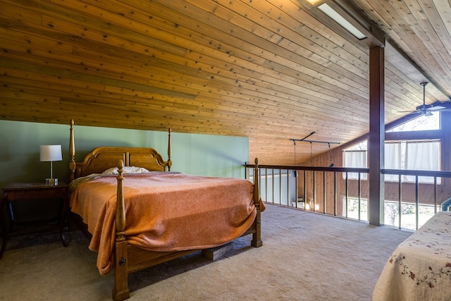 carpeted bedroom with ceiling fan, wood ceiling, and vaulted ceiling