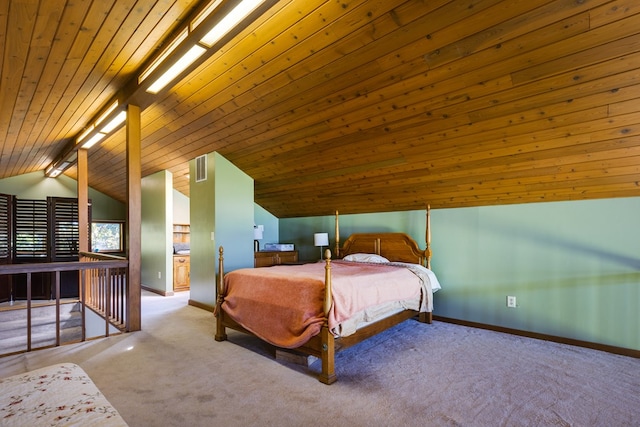 carpeted bedroom featuring lofted ceiling and wood ceiling